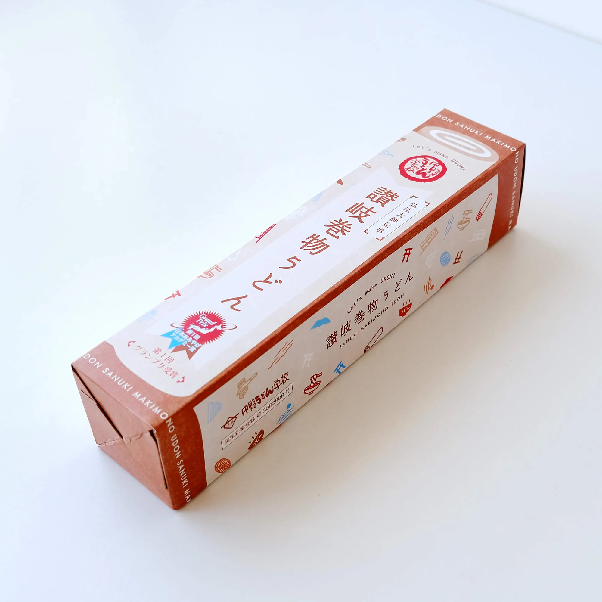 香川県の高松と琴平にある中野うどん学校で販売されている「讃岐巻物うどん」のパッケージデザイン